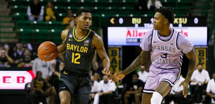 A Baylor basketball player dribbling down the court.