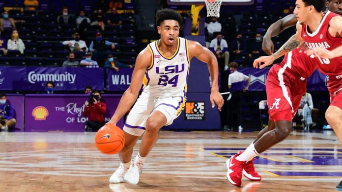 An LSU basketball player dribbling down the court