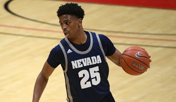 A Nevada player dribbling up the court.