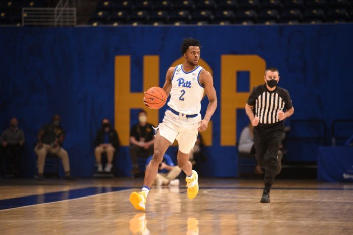 A Pittsburgh player dribbling down the court