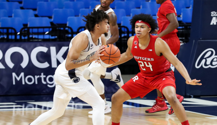 A Rutgers player posted up on defense.