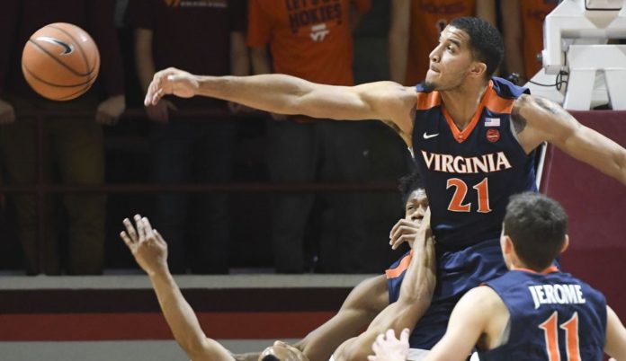 a UVA player blocking their opponent.