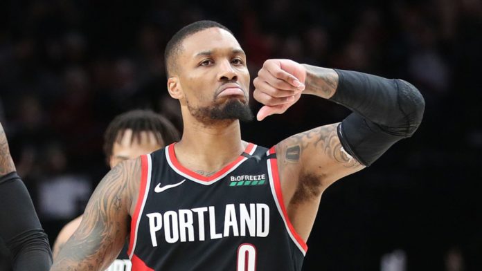 Damian Lillard doing his trademark "It's Dame Time" move.