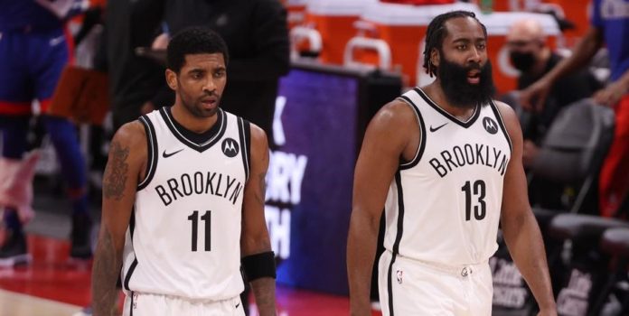 Nets' stars Kyrie Irving and James Harden walking together.