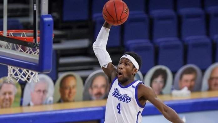 A Drake basketball player soaring in for the slam dunk.