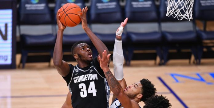 A Georgetown player driving to the rim.