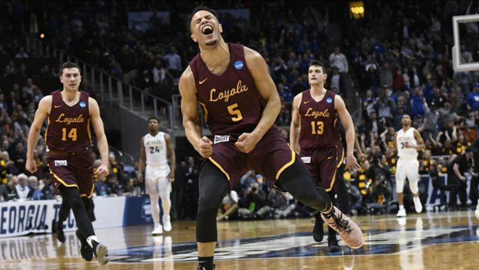 Loyola Chicago players celebrating on the hardwood.