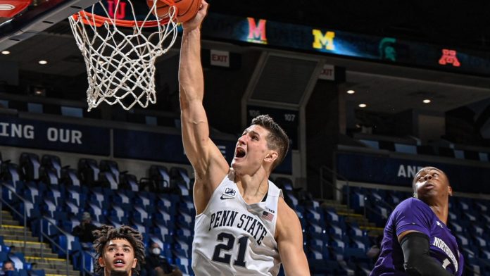 A Penn State basketball play dunking with ferocity.