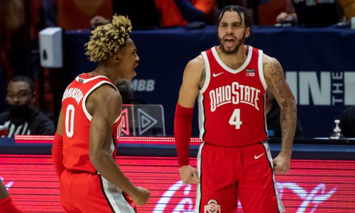 Ohio State basketball players fired up during a game.