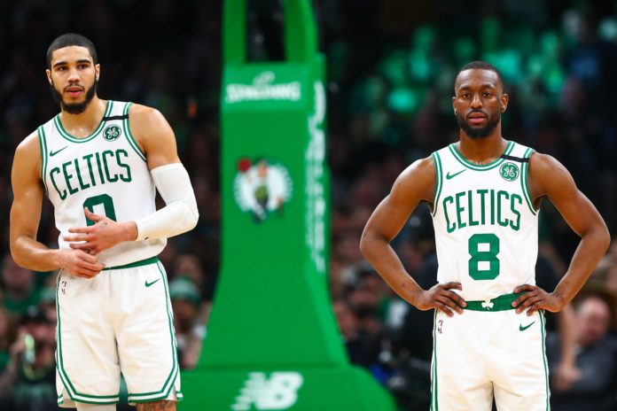 Boston Celtics players poised before a game.