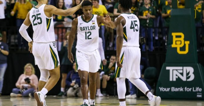 Baylor basketball players celebrating on the hardwood.