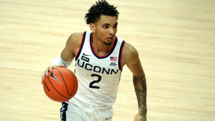 UConn star James Bouknight dribbling down the court.