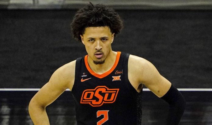 Oklahoma State basketball star Cade Cunningham posing on the court.