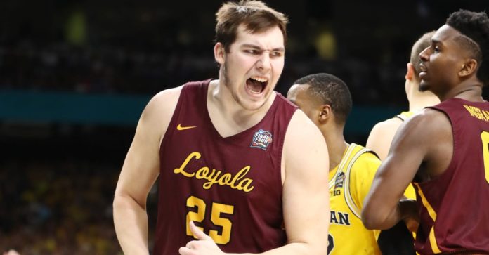 Loyola-Chicago star center Cameron Krutwig celebrating.