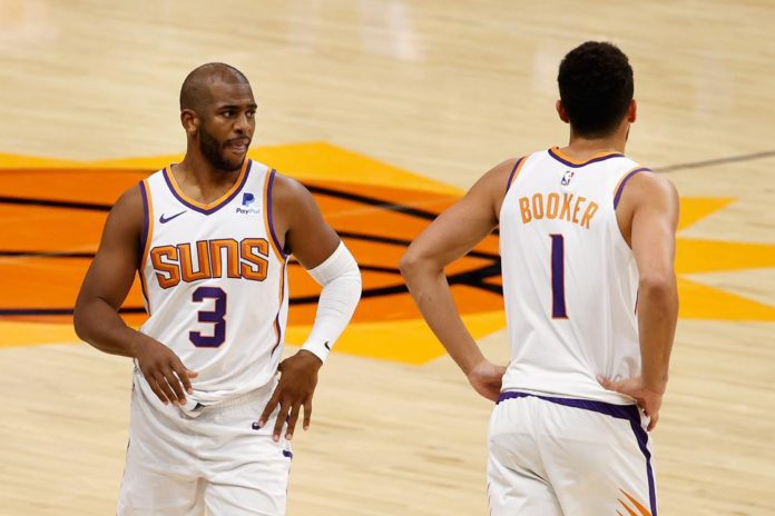 Phoenix Suns' stars Devin Booker and Chris Paul.