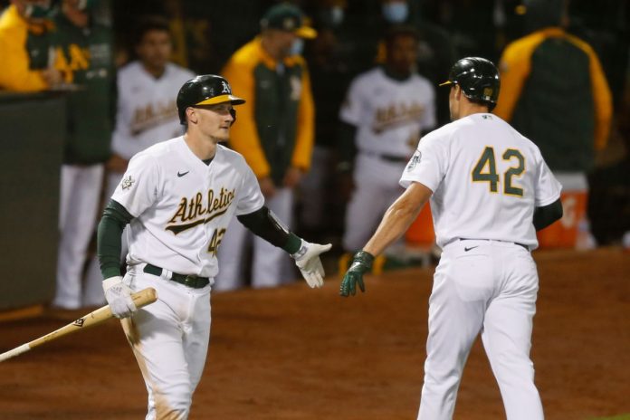 Athletics players celebrating after dismantling the Tigers.