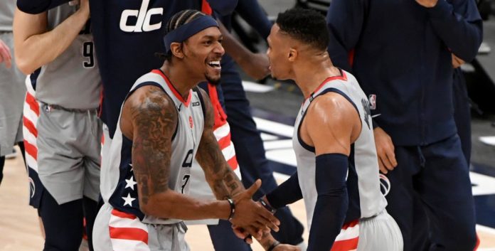 WASHINGTON, DC - JANUARY 31: Russell Westbrook #4 of the Washington Wizards celebrates with Bradley Beal #3 after making the game-winning shot against the Brooklyn Nets during the second half at Capital One Arena on January 31, 2021 in Washington, DC. NOTE TO USER: User expressly acknowledges and agrees that, by downloading and or using this photograph, User is consenting to the terms and conditions of the Getty Images License Agreement. (Photo by Will Newton/Getty Images)