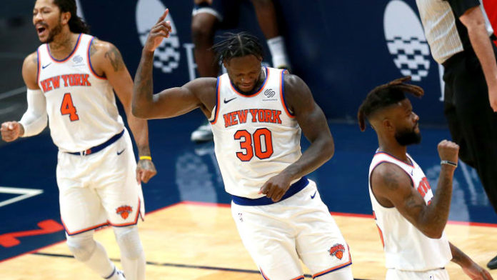 Knicks players celebrating.