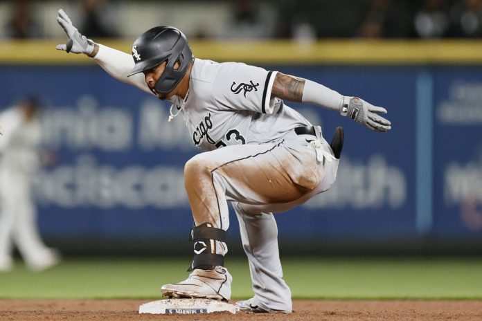 White Sox hitter Yermin Mercedes celebrating after a hit.