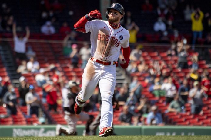 Boston Red Sox hitter rounding the bases.