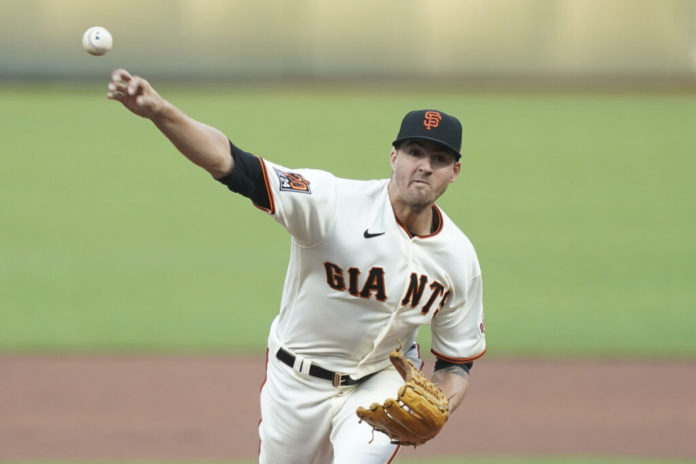 August 20, 2020; San Francisco, California, USA; San Francisco Giants starting pitcher Kevin Gausman (34) delivers a pitch against the Los Angeles Angels during the first inning at Oracle Park. Mandatory Credit: Kyle Terada-USA TODAY Sports