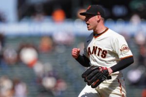 Giants' starting pitcher Anthony DeSclafani, celebrating at the mound.