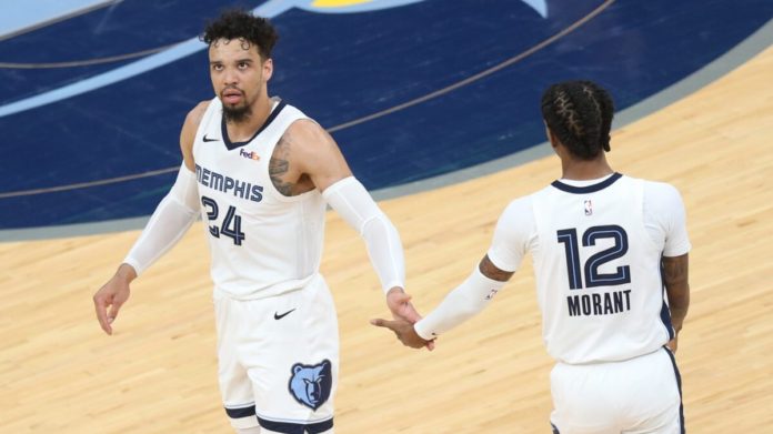 Ja Morant and a teammate on the court.