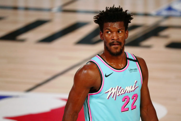 LAKE BUENA VISTA, FLORIDA - AUGUST 10: Jimmy Butler #22 of the Miami Heat looks on during the first half against the Indiana Pacers at Visa Athletic Center at ESPN Wide World Of Sports Complex on August 10, 2020 in Lake Buena Vista, Florida. NOTE TO USER: User expressly acknowledges and agrees that, by downloading and or using this photograph, User is consenting to the terms and conditions of the Getty Images License Agreement. (Photo by Kim Klement - Pool/Getty Images)