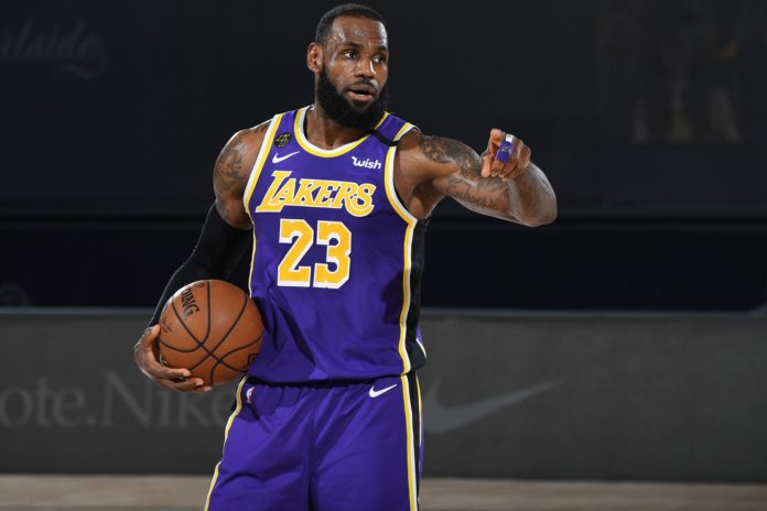 ORLANDO, FL - SEPTEMBER 26: LeBron James #23 of the Los Angeles Lakers looks on during the game against the Denver Nuggets during Game Five of the Western Conference Finals on September 26, 2020 in Orlando, Florida at AdventHealth Arena. NOTE TO USER: User expressly acknowledges and agrees that, by downloading and/or using this Photograph, user is consenting to the terms and conditions of the Getty Images License Agreement. Mandatory Copyright Notice: Copyright 2020 NBAE (Photo by Andrew D. Bernstein/NBAE via Getty Images)