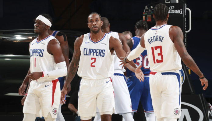 NEW YORK, NY - JANUARY 31: Kawhi Leonard #2 of the LA Clippers high fives Paul George #13 of the LA Clippers during the game against the New York Knicks on January 31, 2021 at Madison Square Garden in New York City, New York. NOTE TO USER: User expressly acknowledges and agrees that, by downloading and or using this photograph, User is consenting to the terms and conditions of the Getty Images License Agreement. Mandatory Copyright Notice: Copyright 2021 NBAE (Photo by Nathaniel S. Butler/NBAE via Getty Images)