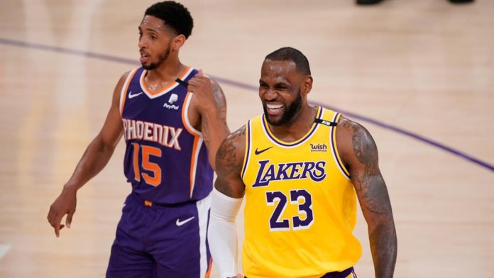 Lebron James smiling on the court as LAL dominates the Suns.