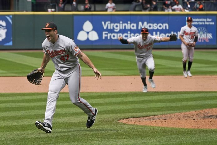 Baltimore Orioles' ace John Means, celebrating after pitching a no hitter against the Mariners.