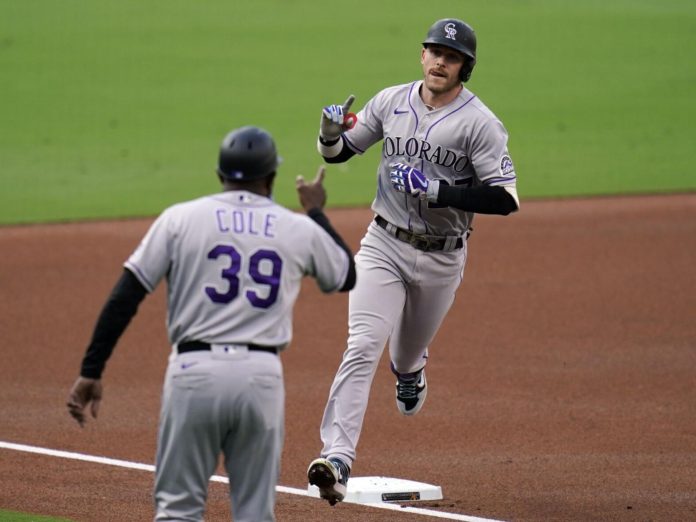 A Colorado Rockies' hitter rounding the bases after a homerun.