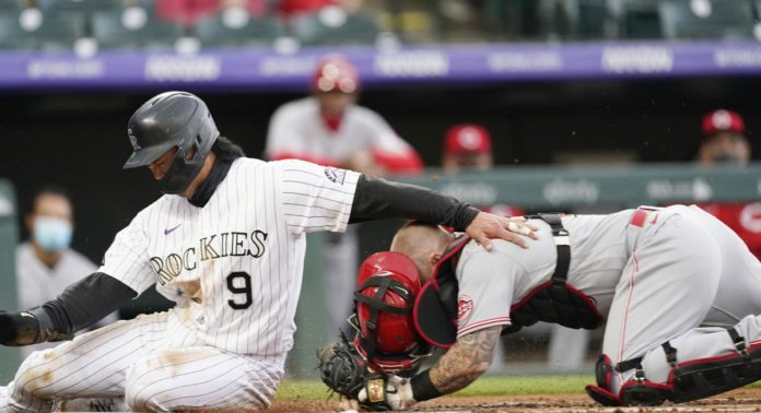 The Reds and Rockies battling at Coors Field.