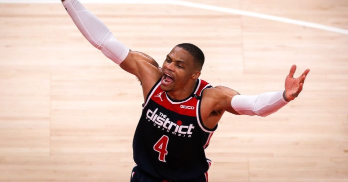 Russel Westbrook, flexing and celebrating on the hardwood.