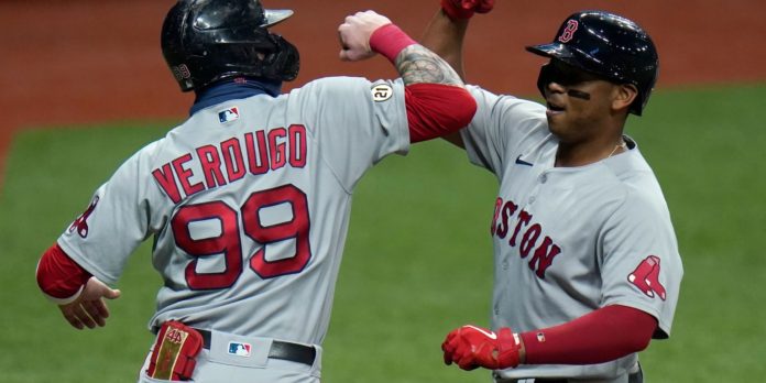 Red Sox hitters celebrating after a big hit.