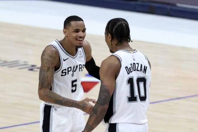 Spurs players shaking hands mid-game.