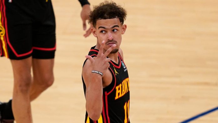 Hawks' star Trae Young telling the crowd to shh.