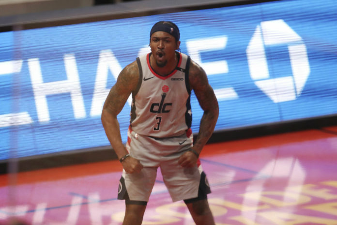 Bradley Beal, the NBA and Wizards star, flexing on the hardwood.