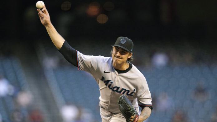 Miami Marlins starting pitcher Jordan Holloway throws a pitch against the Arizona Diamondbacks during the first inning of a baseball game Monday, May 10, 2021, in Phoenix. (AP Photo/Ross D. Franklin)