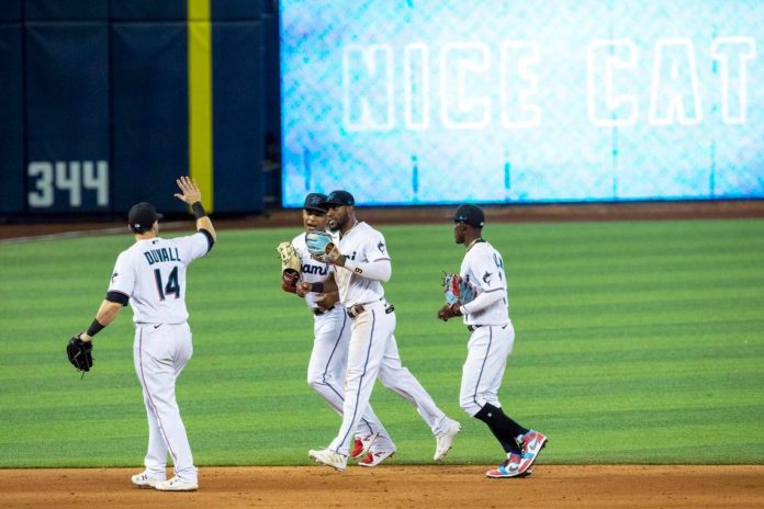 Marlins players on their field.