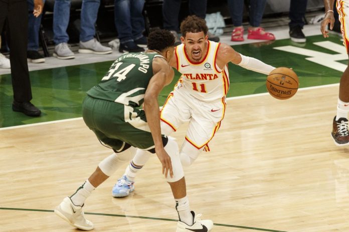 Trae Young and Giannis squaring off on the hardwood in game 1 of the East Finals.