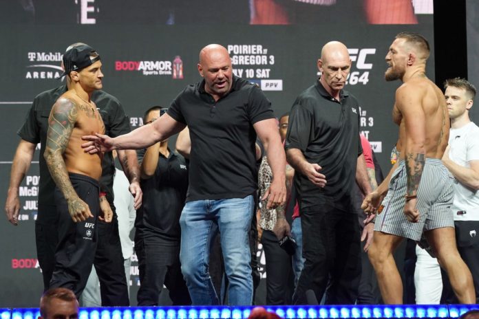 Conor McGregor and Dustin Poirier at their weigh in on July 9.