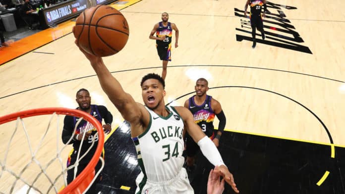 Giannis, the Bucks' star and former MVP, driving the ball to the rim.