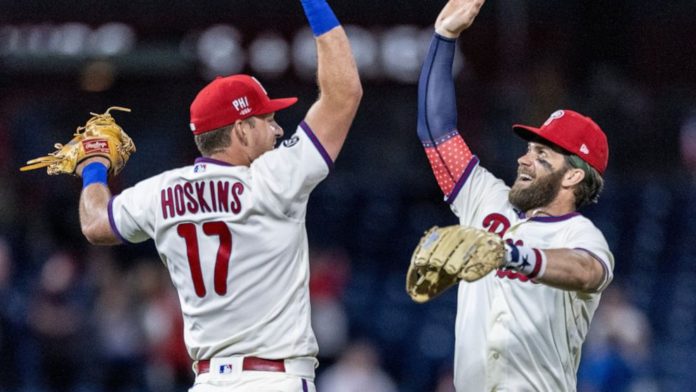 Phillies' hitters celebrating together.