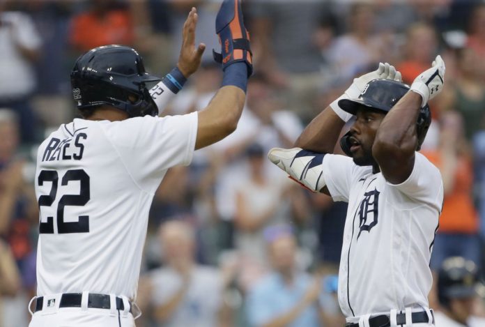 Detroit Tigers players high-fiving after a run.