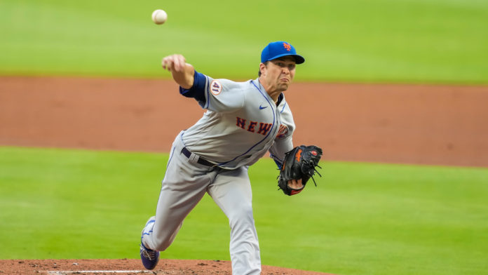 Jacob deGrom winding back for a big pitch.