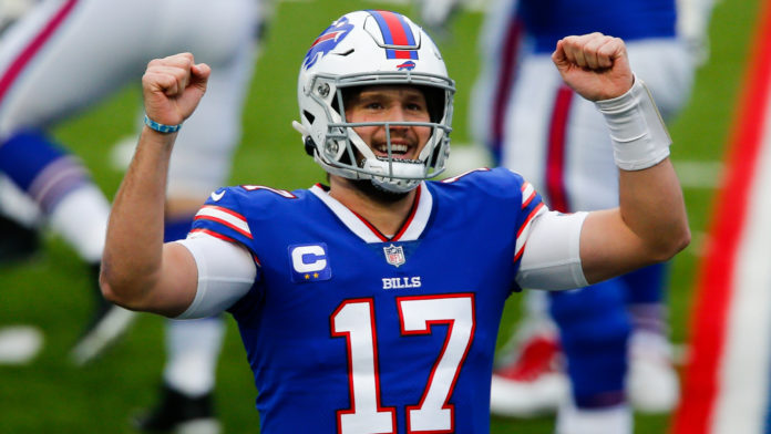 Buffalo Bills quarterback Josh Allen (17) reacts after throwing a touchdown pass in the first half of an NFL football game against the Miami Dolphins, Sunday, Jan. 3, 2021, in Orchard Park, N.Y. (AP Photo/John Munson)