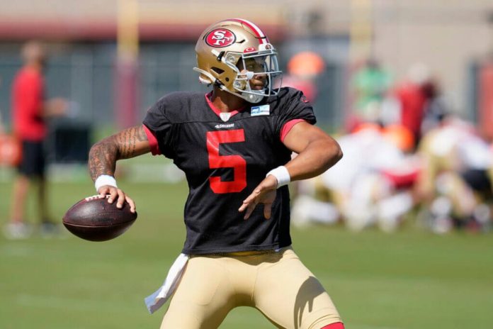 49ers 1st round pick Trey Lance on the field.