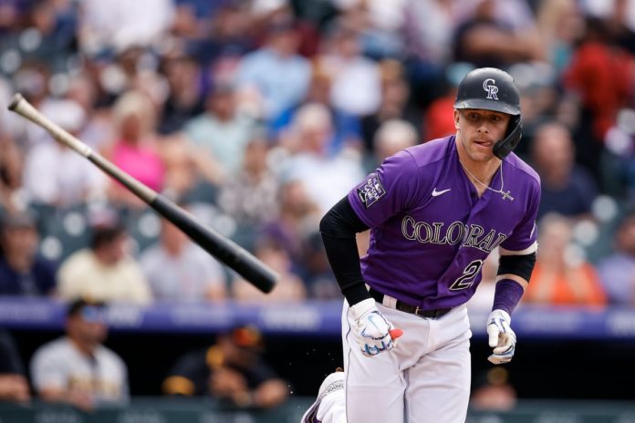 A Rockies' batter slinging a homerun.